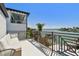Relaxing balcony with outdoor seating and a beautiful view of the water and nearby boats at 2233 Donato Dr, Belleair Beach, FL 33786
