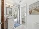 Bathroom featuring modern vessel sink vanity and walk-out door access at 2233 Donato Dr, Belleair Beach, FL 33786