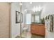 The bathroom boasts a walk-in shower, granite vanity, and a toilet at 2233 Donato Dr, Belleair Beach, FL 33786
