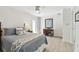 Bright bedroom with coastal decor, a ceiling fan, and a door to the outside at 2233 Donato Dr, Belleair Beach, FL 33786
