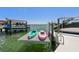 Two kayaks are parked on a boat lift on a sunny day at 2233 Donato Dr, Belleair Beach, FL 33786