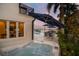 Inviting hot tub near the water, complemented by comfortable patio seating and shade umbrellas at 2233 Donato Dr, Belleair Beach, FL 33786