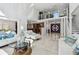 Spacious living room featuring soaring ceilings, clerestory windows and open access to the kitchen at 2233 Donato Dr, Belleair Beach, FL 33786