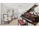 Loft featuring a piano and seating area with natural light and views of the property at 2233 Donato Dr, Belleair Beach, FL 33786