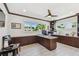 Office features custom built-ins, granite counters, wood trim, and ample natural light at 2233 Donato Dr, Belleair Beach, FL 33786