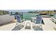 A covered outdoor patio offers comfortable seating and scenic water views at 2233 Donato Dr, Belleair Beach, FL 33786
