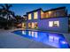 Sparkling pool with waterfront views, a patio area, and a balcony overlooking the serene canal at 2233 Donato Dr, Belleair Beach, FL 33786