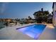 Inviting pool area with patio furniture, offering a relaxing space for outdoor entertaining at 2233 Donato Dr, Belleair Beach, FL 33786