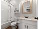 Clean bathroom features a shower-tub combo, white vanity, and a framed mirror at 23935 Coral Ridge Ln, Land O Lakes, FL 34639