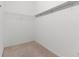 Empty walk-in closet featuring carpeted flooring and wire shelving for storage at 23935 Coral Ridge Ln, Land O Lakes, FL 34639