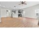 Spacious living room and kitchen with wood tile flooring and stainless steel appliances at 23935 Coral Ridge Ln, Land O Lakes, FL 34639
