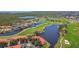 Picturesque aerial view of a community, surrounded by a golf course and serene lakes, offering stunning scenery at 2400 Feather Sound Dr # 735, Clearwater, FL 33762