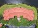 Stunning aerial view showcasing the unique architecture and red tile roof design of the building near the water at 2400 Feather Sound Dr # 735, Clearwater, FL 33762