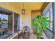 Relaxing balcony space with lake views, outdoor seating, and stylish tile flooring at 2400 Feather Sound Dr # 735, Clearwater, FL 33762