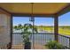Outdoor balcony showcasing views of a serene lake and lush green golf course at 2400 Feather Sound Dr # 735, Clearwater, FL 33762