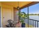 Serene balcony area with views of a tranquil lake and comfortable outdoor seating at 2400 Feather Sound Dr # 735, Clearwater, FL 33762