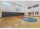 Community basketball court with hardwood floors and natural light at 2400 Feather Sound Dr # 735, Clearwater, FL 33762