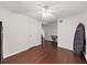 A simple bedroom with wood flooring and a ceiling fan at 2400 Feather Sound Dr # 735, Clearwater, FL 33762