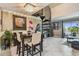 The dining area is open to the living space with spiral staircase at 2400 Feather Sound Dr # 735, Clearwater, FL 33762