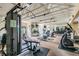 Community gym with weight machines, mirrors, and ceiling fans at 2400 Feather Sound Dr # 735, Clearwater, FL 33762