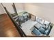 A spiral staircase overlooking the open concept living room with a waterfront view at 2400 Feather Sound Dr # 735, Clearwater, FL 33762