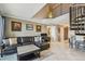 Open-concept living space featuring tile floors, a modern sofa, access to the balcony, and a spiral staircase at 2400 Feather Sound Dr # 735, Clearwater, FL 33762