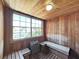 Relaxing sauna room with wooden benches, walls and a large window providing natural light at 2400 Feather Sound Dr # 735, Clearwater, FL 33762
