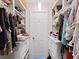 A well-organized walk-in closet featuring ample storage space and built-in shelving at 2400 Feather Sound Dr # 735, Clearwater, FL 33762