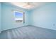 Light blue bedroom with a window offering a view of the bay at 2700 Bayshore Blvd # 511, Dunedin, FL 34698