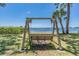 Secluded bench with relaxing water view and lush greenery at 2700 Bayshore Blvd # 511, Dunedin, FL 34698