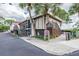 Exterior of community clubhouse with tropical foliage, providing a relaxing atmosphere for residents at 2700 Bayshore Blvd # 511, Dunedin, FL 34698