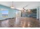 Open living room featuring water view, wood-look floors and decorative wall at 2700 Bayshore Blvd # 511, Dunedin, FL 34698