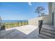Private patio with wrought iron railing, offering stunning water views and outdoor relaxation space at 2700 Bayshore Blvd # 511, Dunedin, FL 34698