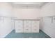 Walk-in closet with built-in drawers and shelving for optimal storage at 2700 Bayshore Blvd # 511, Dunedin, FL 34698