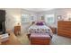 Comfortable bedroom with plush carpet, matching furniture, and natural light from large windows at 2702 Ochatilla Rd, Holiday, FL 34691
