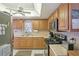Bright kitchen showcasing wood cabinets, stainless appliances, and a window over the sink at 2702 Ochatilla Rd, Holiday, FL 34691