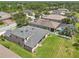 Aerial view of the home showcasing the spacious backyard, screened pool, and surrounding neighborhood at 2803 130Th E Ave, Parrish, FL 34219