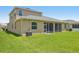 The backyard with a screened patio that provides an ideal space for outdoor relaxation and entertainment at 2803 130Th E Ave, Parrish, FL 34219