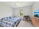 Cozy bedroom with comfortable bed, window, dresser, and TV for relaxing nights in at 2803 130Th E Ave, Parrish, FL 34219