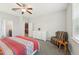 Bright bedroom boasts a large window, soft carpet, and a comfy chair for reading and relaxation at 2803 130Th E Ave, Parrish, FL 34219