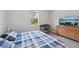 Comfortable bedroom with a work space, dresser and TV for entertaining, and a window at 2803 130Th E Ave, Parrish, FL 34219