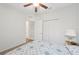Cozy bedroom with ceiling fan, closet, comfortable carpet, and inviting bed with a decorative quilt at 2803 130Th E Ave, Parrish, FL 34219