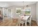 Dining room featuring a white table with seating for four, blinds on windows at 2803 130Th E Ave, Parrish, FL 34219