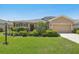 Well-maintained home featuring a lush lawn, mature landscaping, and inviting curb appeal at 2803 130Th E Ave, Parrish, FL 34219