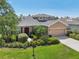 Lovely home with an attached garage, well-maintained landscaping, and a welcoming entrance at 2803 130Th E Ave, Parrish, FL 34219