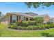 Charming home featuring manicured landscaping, a well-maintained lawn, and a welcoming facade at 2803 130Th E Ave, Parrish, FL 34219