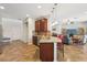 Modern kitchen with stainless steel appliances and a center island open to living area at 2803 130Th E Ave, Parrish, FL 34219