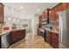 Spacious kitchen with granite countertops, stainless steel appliances, tile backsplash and lighting at 2803 130Th E Ave, Parrish, FL 34219