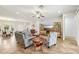 Open-concept living room featuring comfortable seating, entertainment center, and neutral color palette at 2803 130Th E Ave, Parrish, FL 34219
