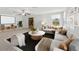 Spacious living room featuring plush seating, a modern coffee table, and a bright window view at 2803 130Th E Ave, Parrish, FL 34219